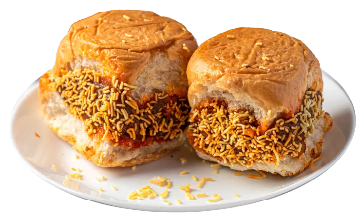 Dabeli - two pieces of spicy potato-filled buns with peanuts, chutney, and sev